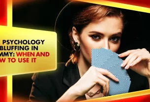 woman playing rummy cards looking at the camera with cards not revealed