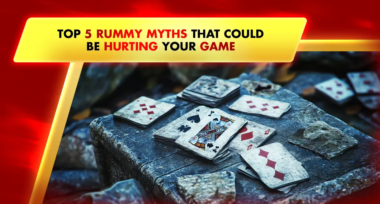 rummy playing cards on blue table