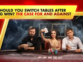 men and woman on live casino table holding playing cards and chips