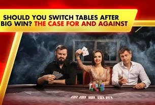 men and woman on live casino table holding playing cards and chips